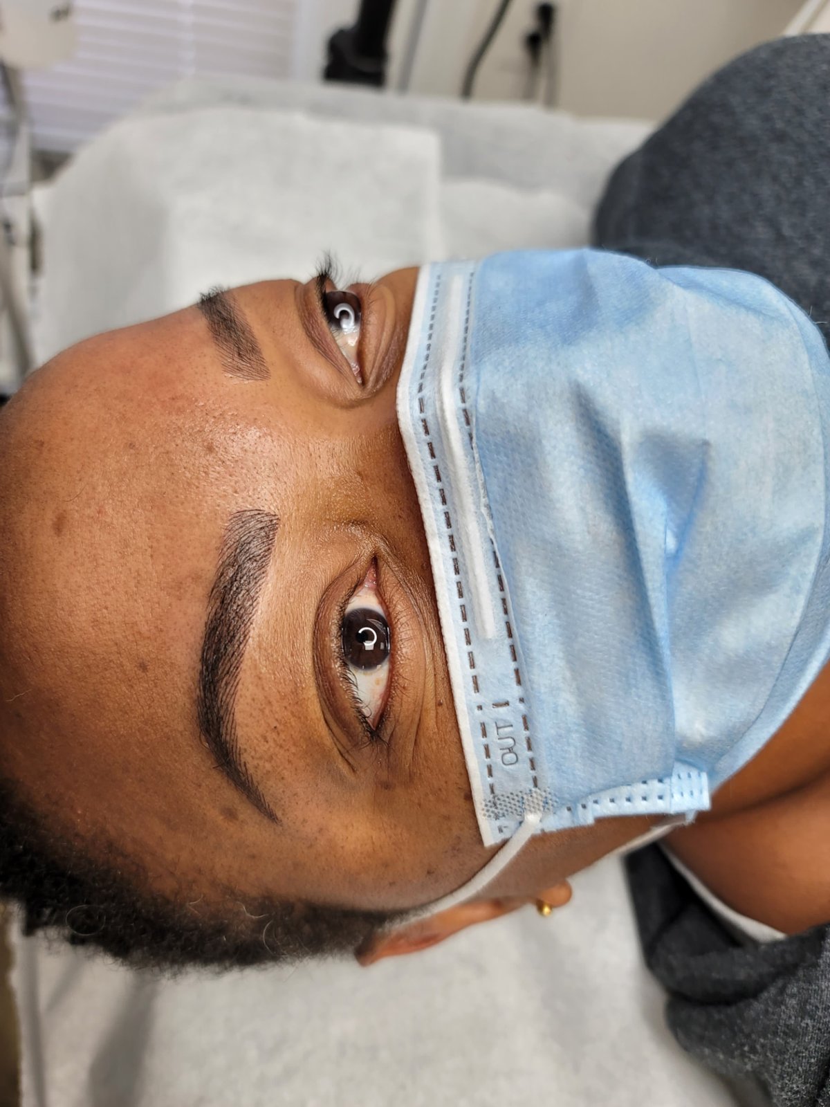 Defined nano brows on deeper skin tone